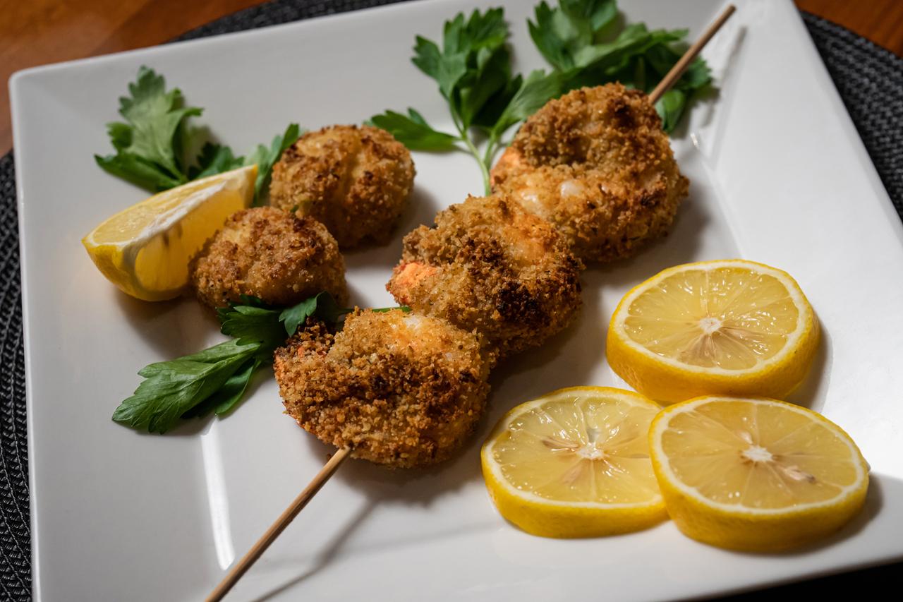 Chef-prepared appetizers plated on a yacht's dining table