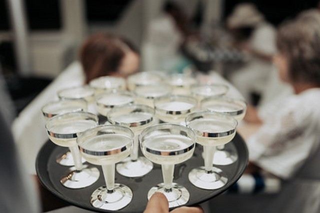 A tray of drinks being served to guests on board