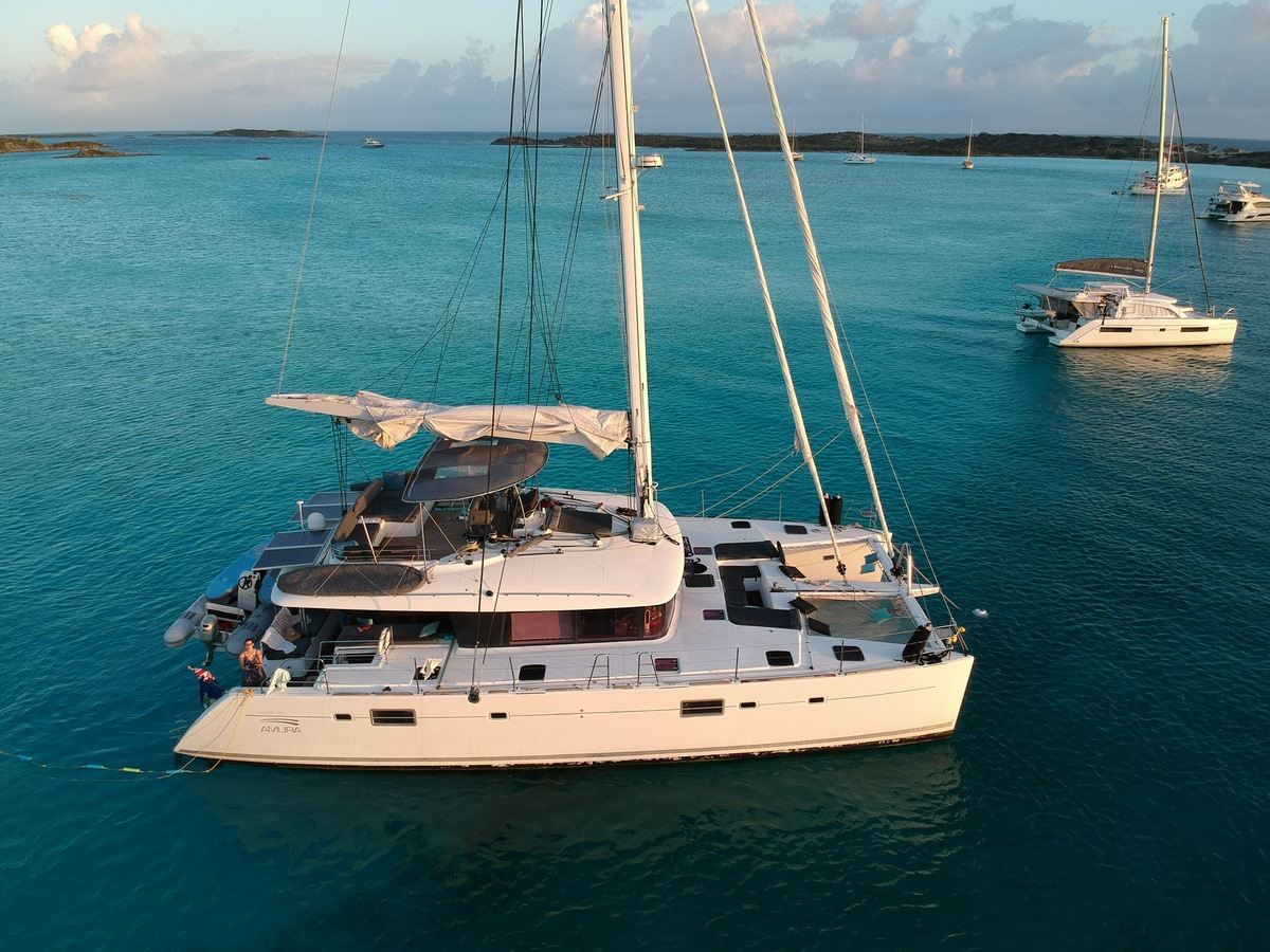 A sailing catamaran anchored in the Exuma Cays, Bahamas