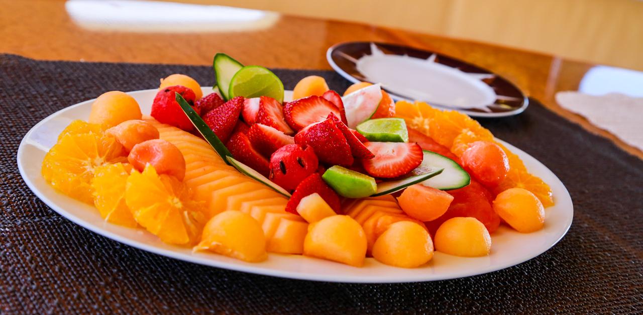 A colorful fruit platter arranged for guests on a yacht