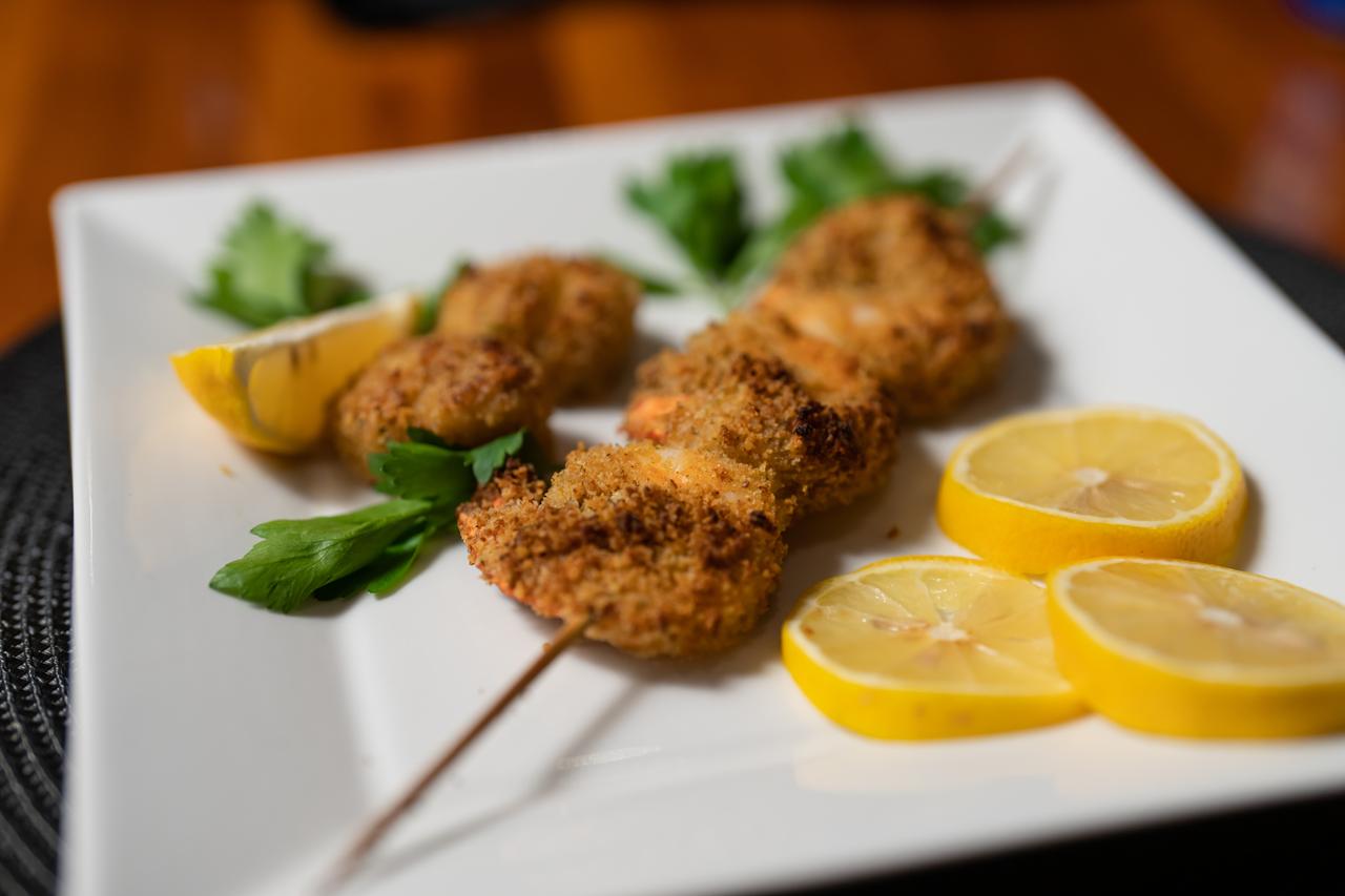 Grilled appetizers with lemon served during a yacht charter