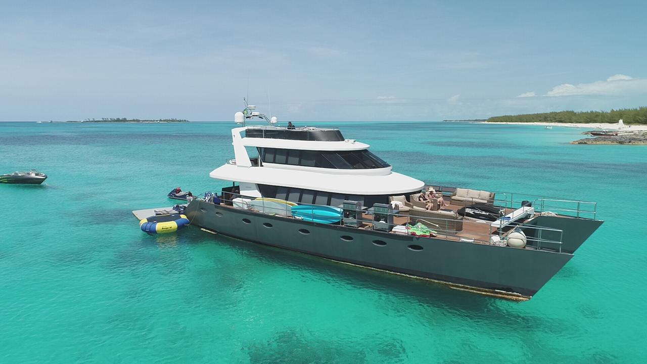 A motor yacht anchored off Rose Island near Nassau, Bahamas