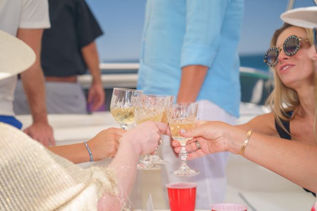 Guests raising a toast during a private yacht charter